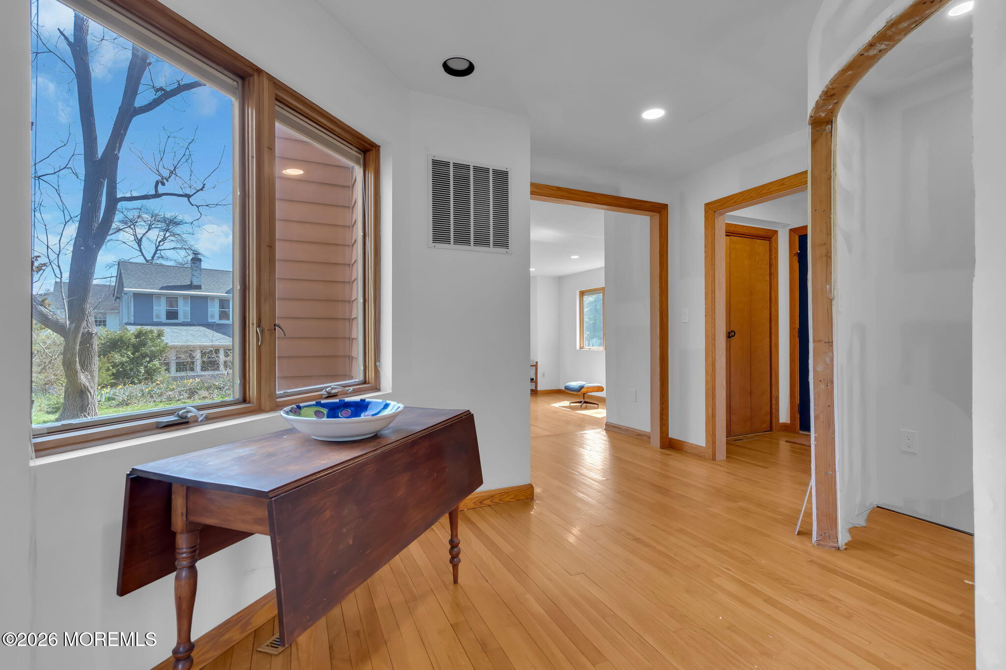 608 Rankin Road Brielle, NJ 08730 - Photo 5 of 27 a dining room with wooden floor and large window