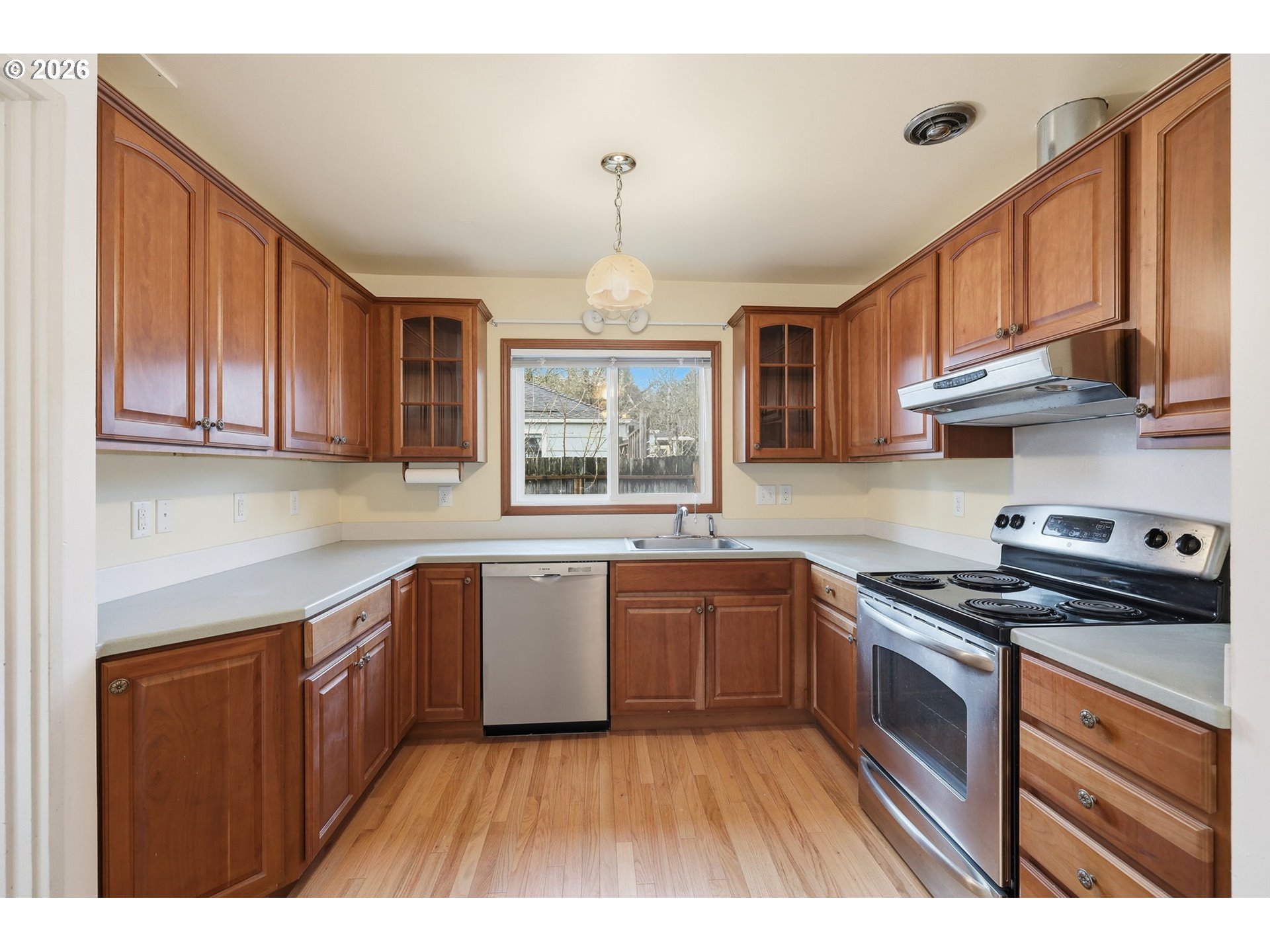 2710 Northwest Garfield Avenue Corvallis, OR 97330 - Photo 14 of 48 a kitchen with stainless steel appliances granite countertop a stove a sink dishwasher and a refrigerator
