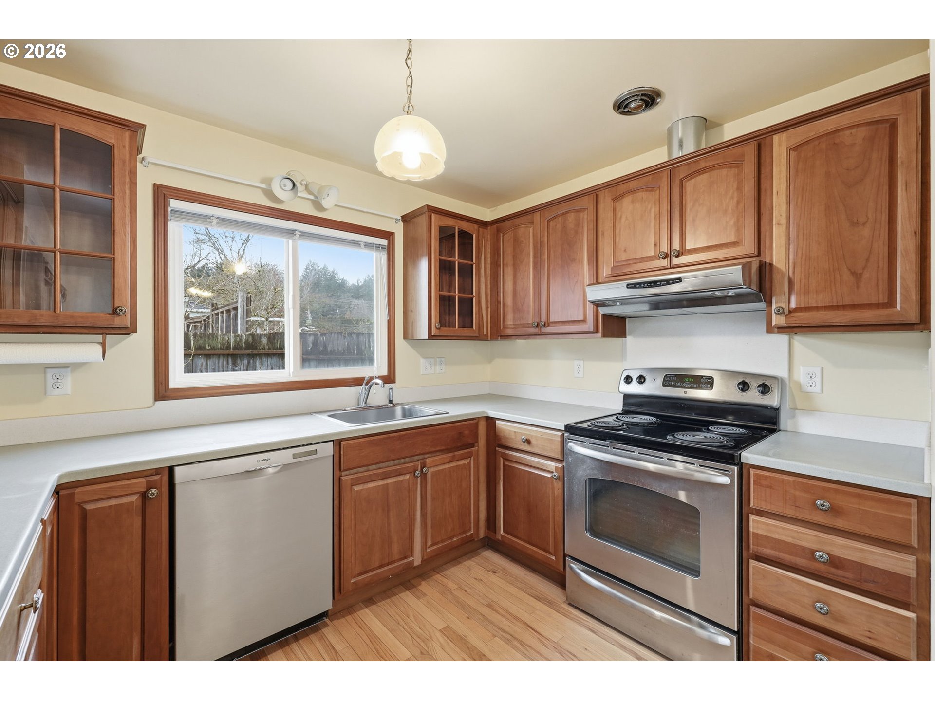 2710 Northwest Garfield Avenue Corvallis, OR 97330 - Photo 17 of 48 a kitchen with stainless steel appliances granite countertop a sink stove and cabinets
