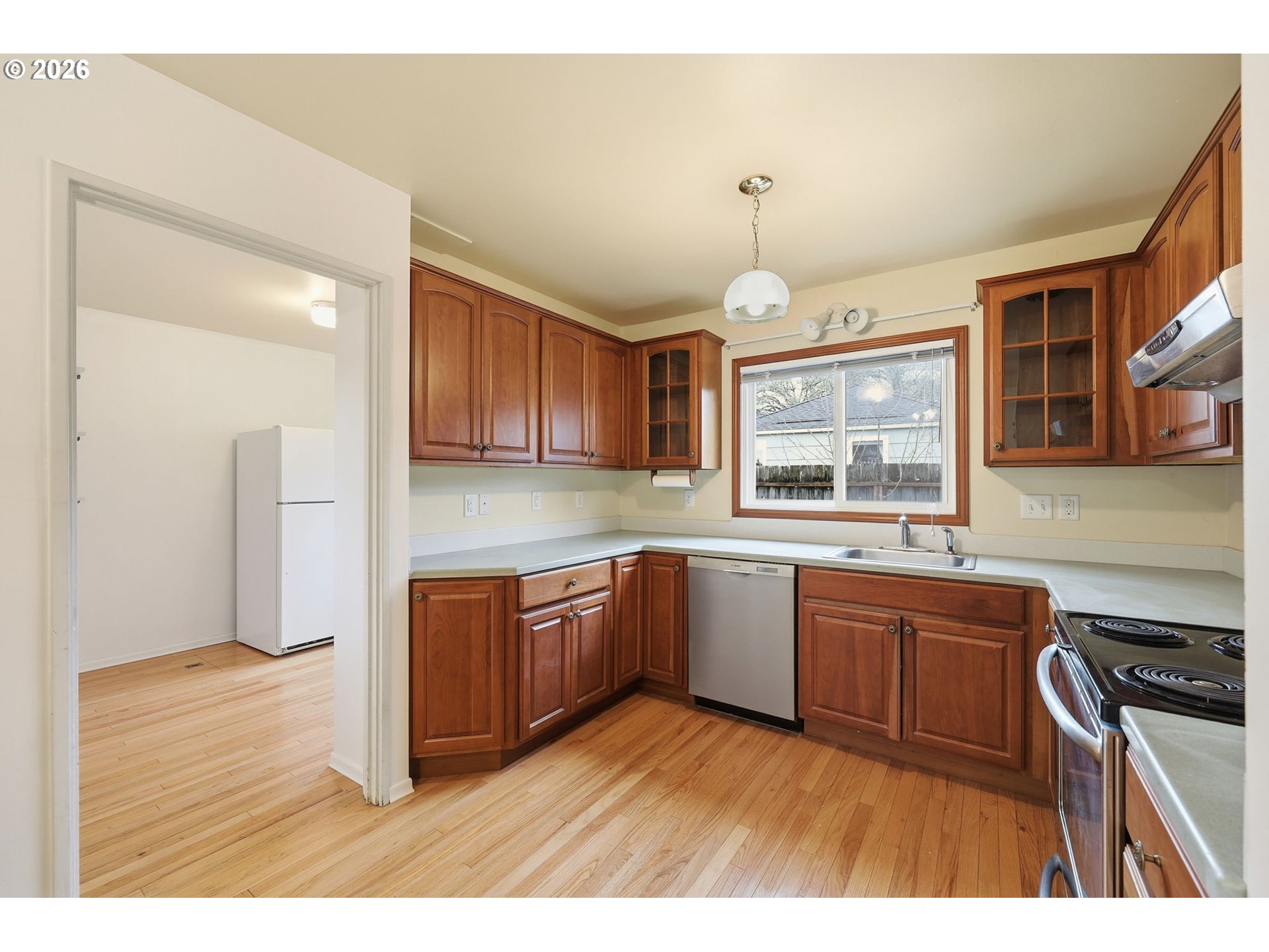 2710 Northwest Garfield Avenue Corvallis, OR 97330 - Photo 18 of 48 a kitchen with stainless steel appliances granite countertop a sink stove and refrigerator