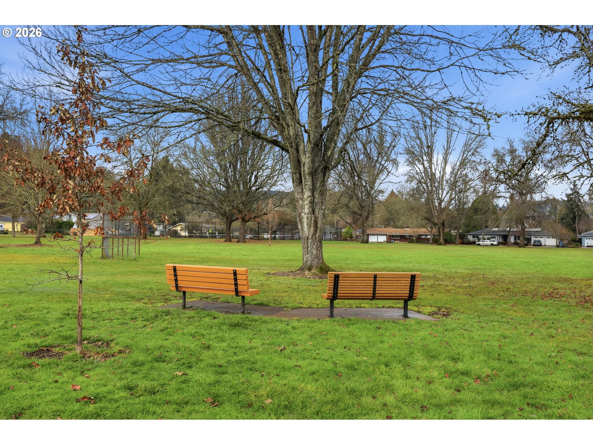 2710 Northwest Garfield Avenue Corvallis, OR 97330 - Photo 47 of 48 a view of a park with bench sitting in middle of garden