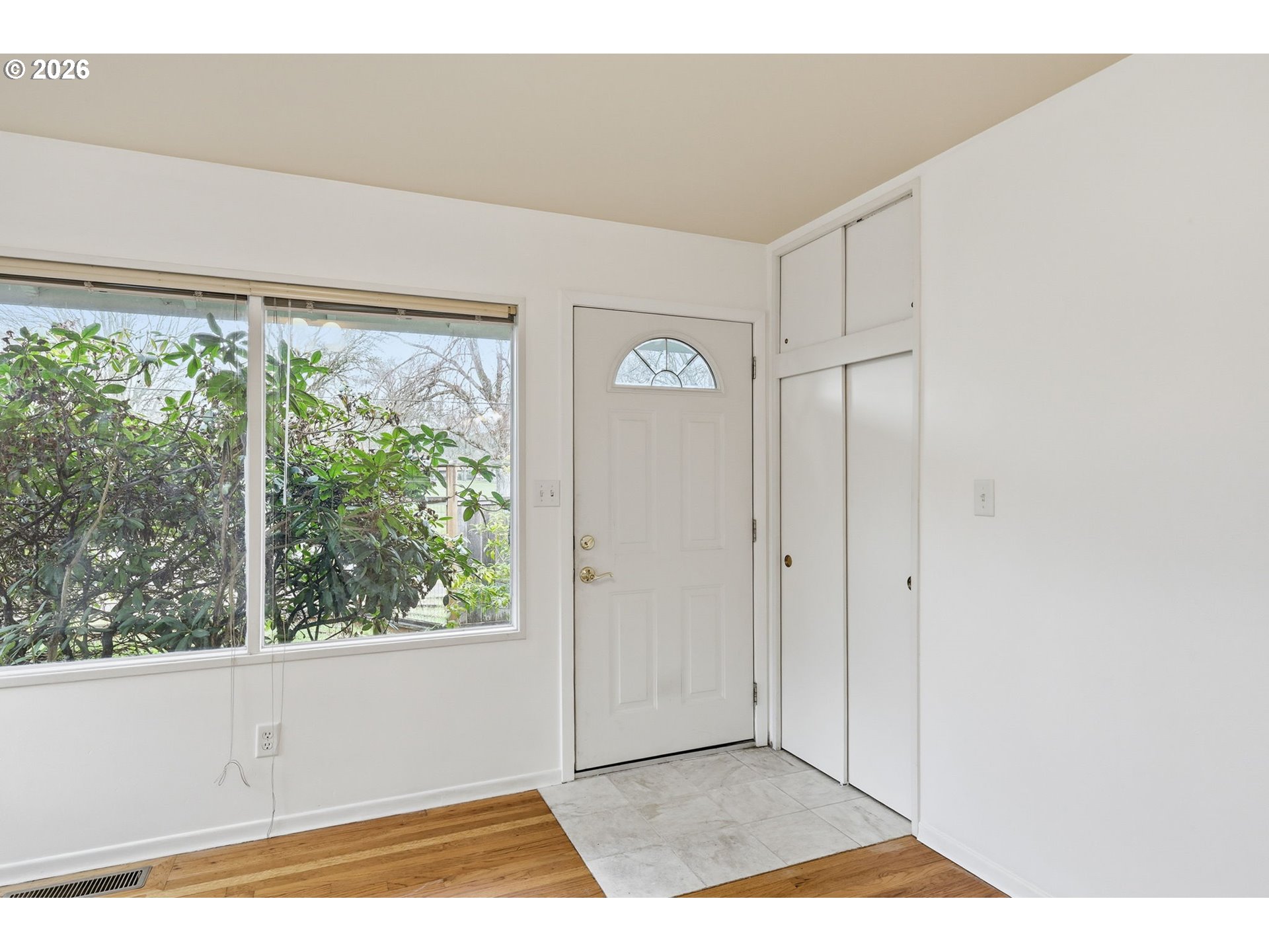 2710 Northwest Garfield Avenue Corvallis, OR 97330 - Photo 5 of 48 a view of an empty room with wooden floor and a window