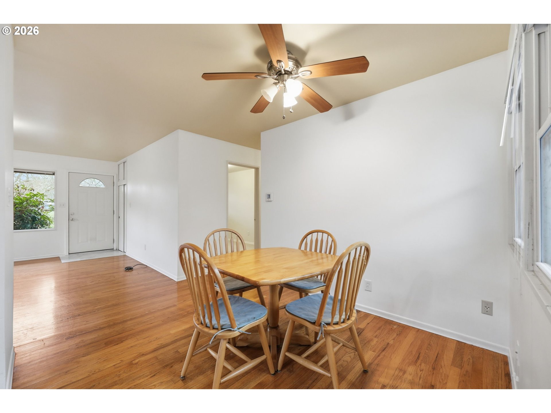 2710 Northwest Garfield Avenue Corvallis, OR 97330 - Photo 10 of 48 a view of a dining room with furniture and wooden floor