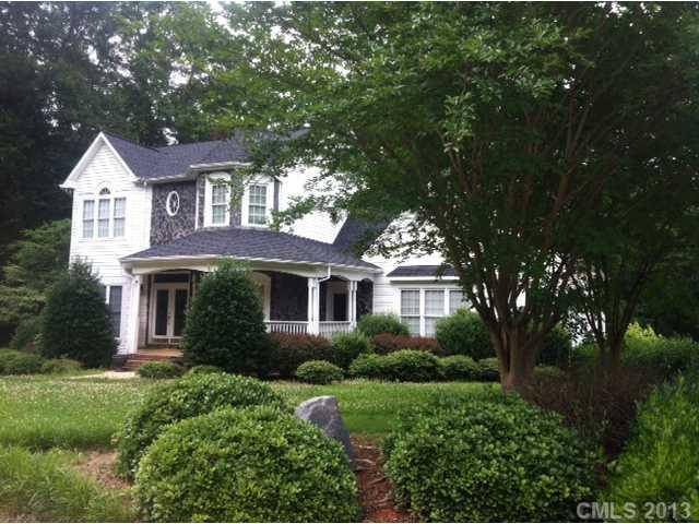 3580 Dobys Bridge Road Fort Mill, SC 29715 - Photo 1 of 15 a front view of a house with a garden