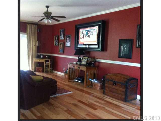 3580 Dobys Bridge Road Fort Mill, SC 29715 - Photo 4 of 15 a living room with furniture a flat screen tv