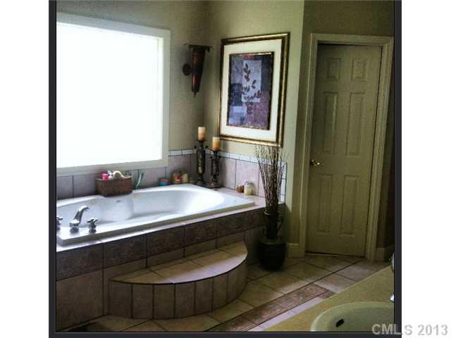 3580 Dobys Bridge Road Fort Mill, SC 29715 - Photo 8 of 15 a bathroom with a sink and a mirror