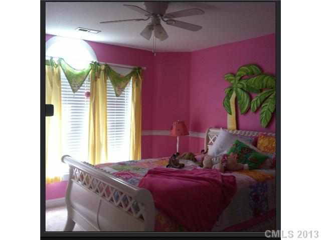 3580 Dobys Bridge Road Fort Mill, SC 29715 - Photo 10 of 15 a bedroom with a bed and a potted plant