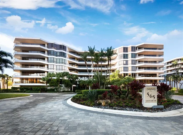 a front view of building with yard