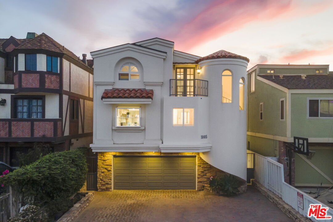 a view of a building with many windows and a yard