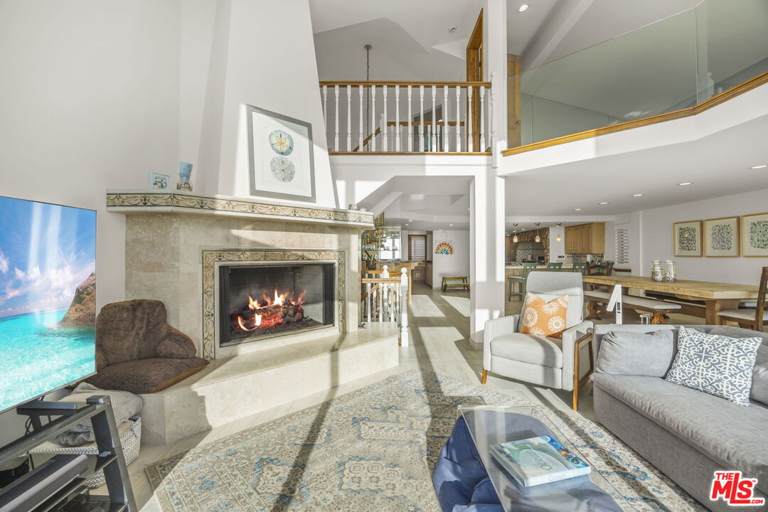 1005 Ocean Drive Oxnard, CA 93035 - Photo 15 of 56 a living room with furniture a window and a fireplace