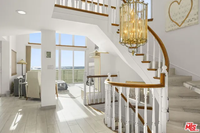 a view of entryway with bathroom and shower