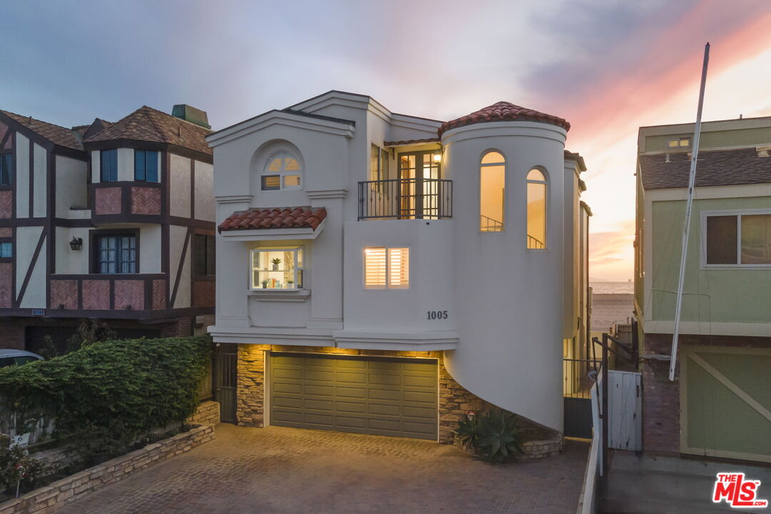 1005 Ocean Drive Oxnard, CA 93035 - Photo 2 of 56 a front view of a house with balcony