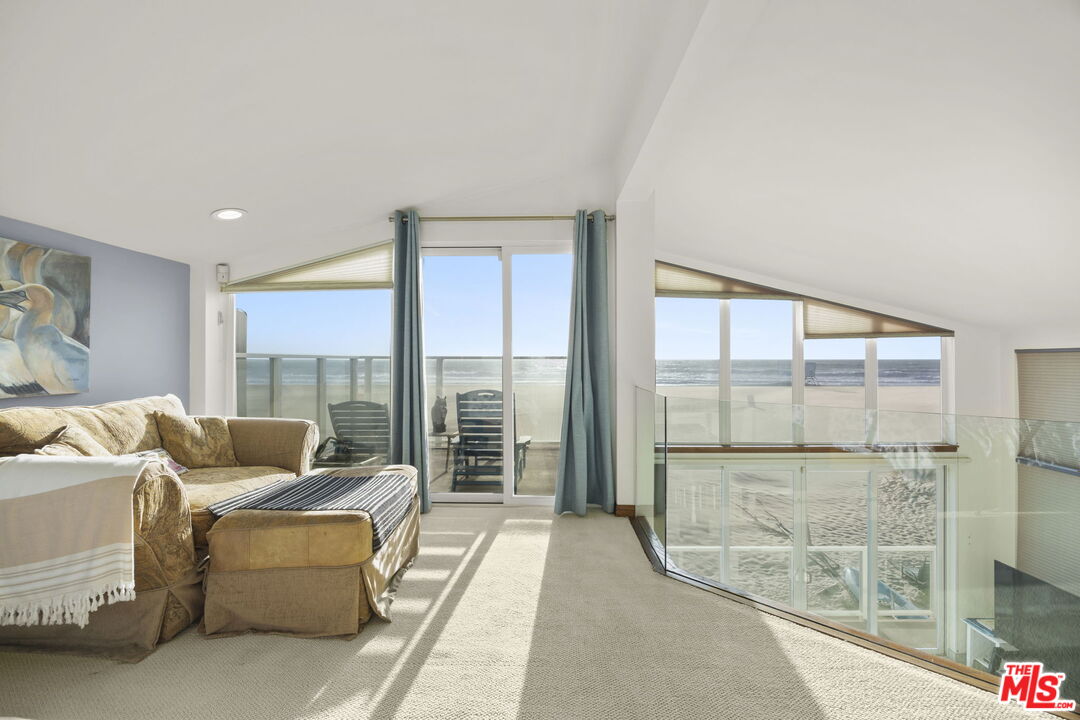 1005 Ocean Drive Oxnard, CA 93035 - Photo 22 of 56 a living room with furniture and a large window