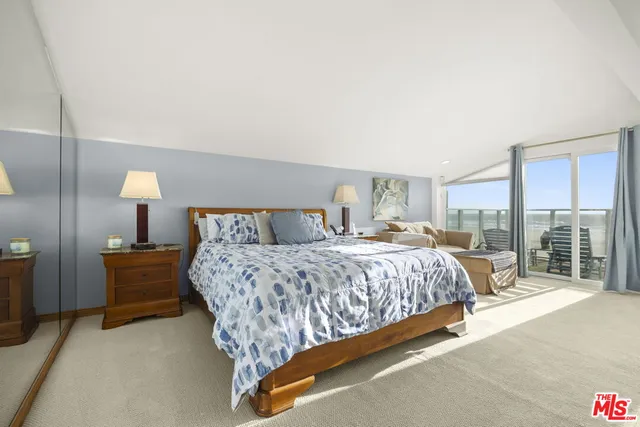 a living room with dining room and wooden floor