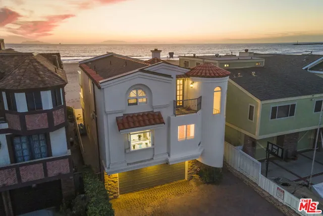 an aerial view of a residential apartment building with a yard