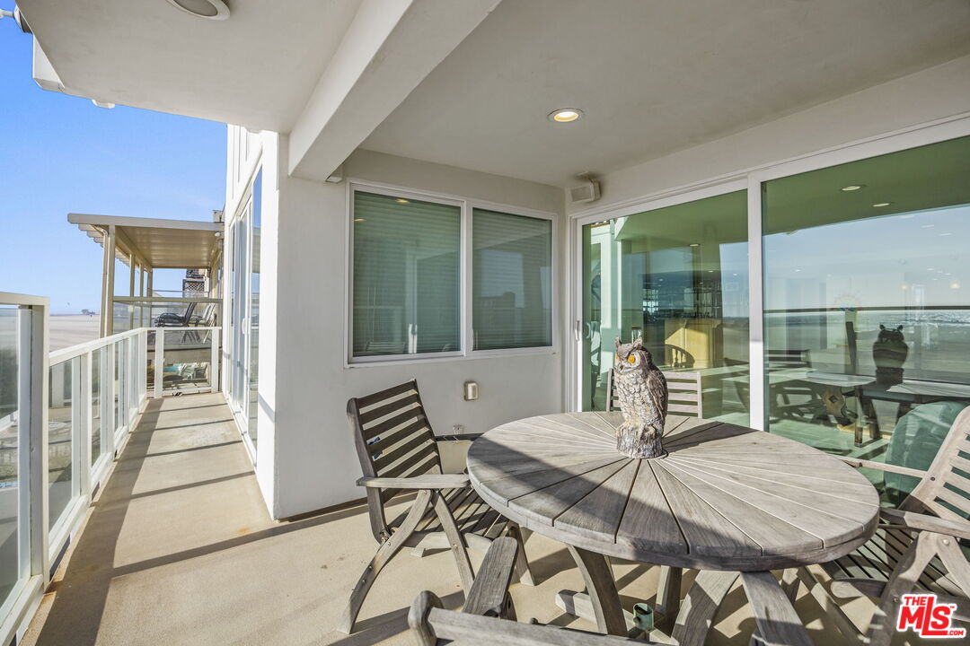 1005 Ocean Drive Oxnard, CA 93035 - Photo 33 of 56 a dining room with furniture and wooden floor
