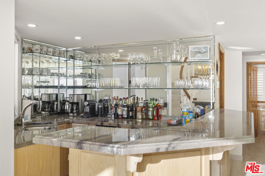 1005 Ocean Drive Oxnard, CA 93035 - Photo 34 of 56 a kitchen with counter top a sink and cabinets