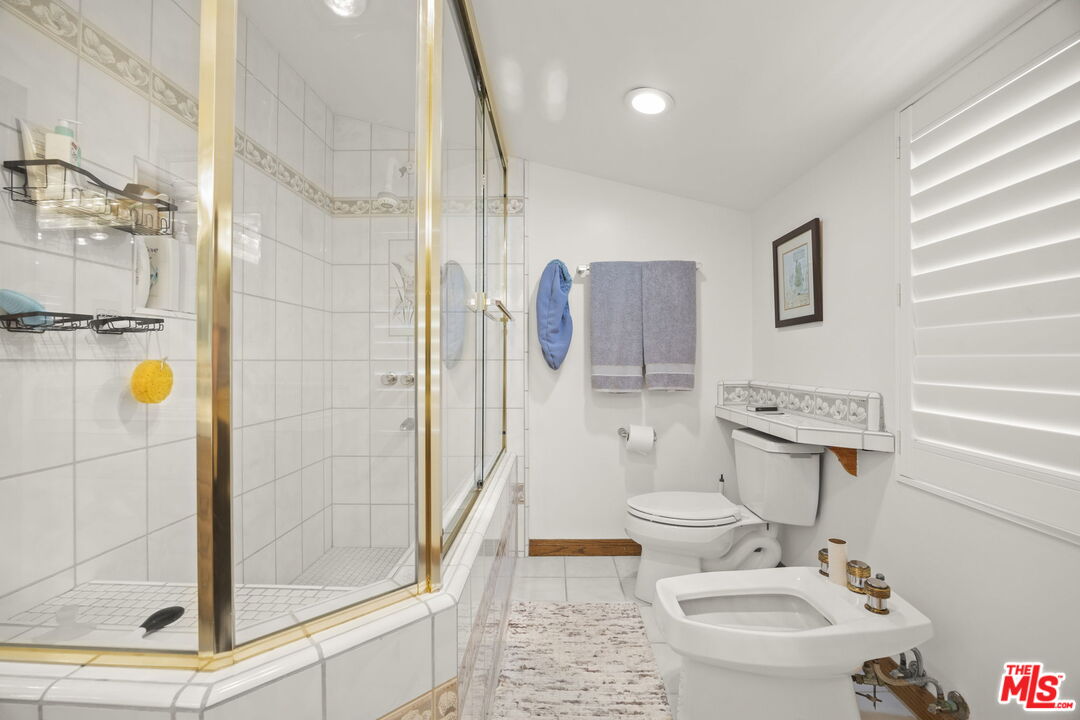 1005 Ocean Drive Oxnard, CA 93035 - Photo 35 of 56 a bathroom with a toilet sink and shower