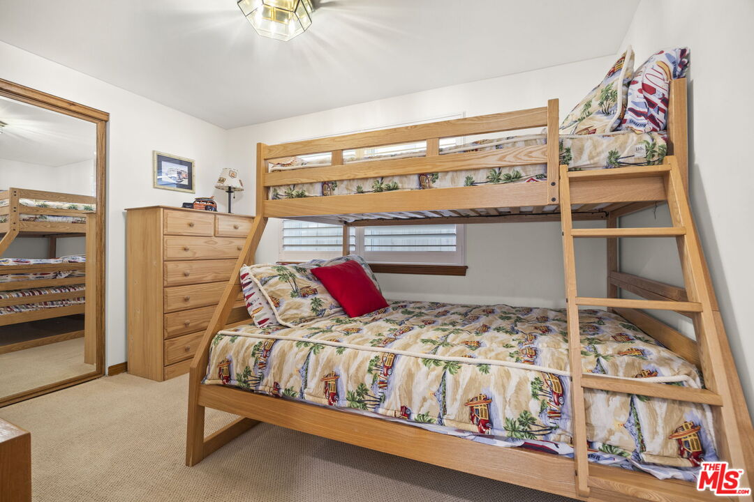 1005 Ocean Drive Oxnard, CA 93035 - Photo 39 of 56 a bedroom with a bed and a window