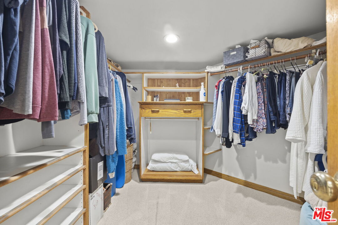 1005 Ocean Drive Oxnard, CA 93035 - Photo 43 of 56 a view of walk in closet with clothes and shoes