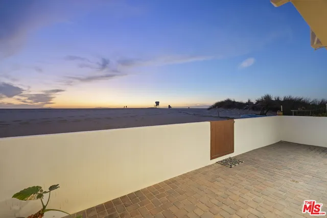 a view of a dining room with furniture wooden floor and a rug