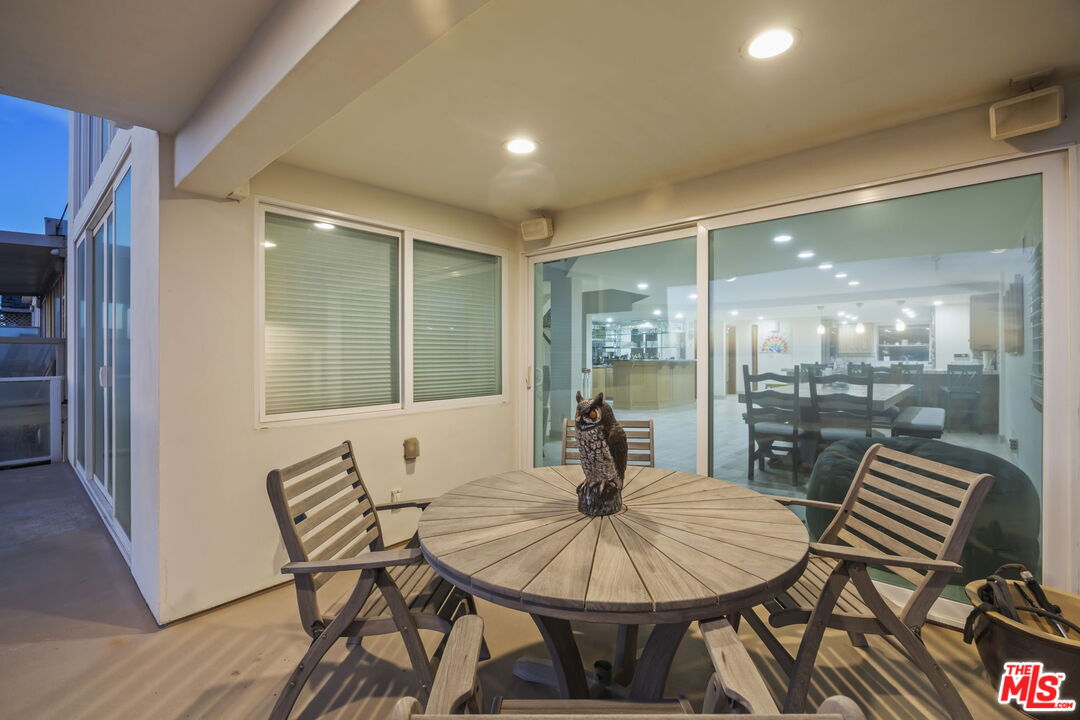 1005 Ocean Drive Oxnard, CA 93035 - Photo 9 of 56 a view of a dining room with furniture wooden floor and a rug