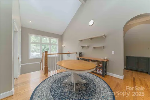 a very nice looking dining room with a large window