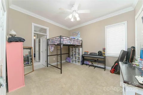 a bedroom with furniture and a window