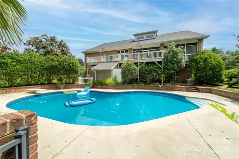 a view of a house with swimming pool