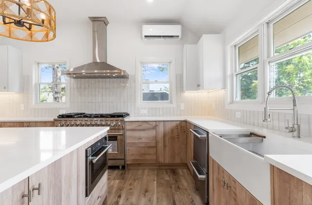 a kitchen with a sink stove and cabinets