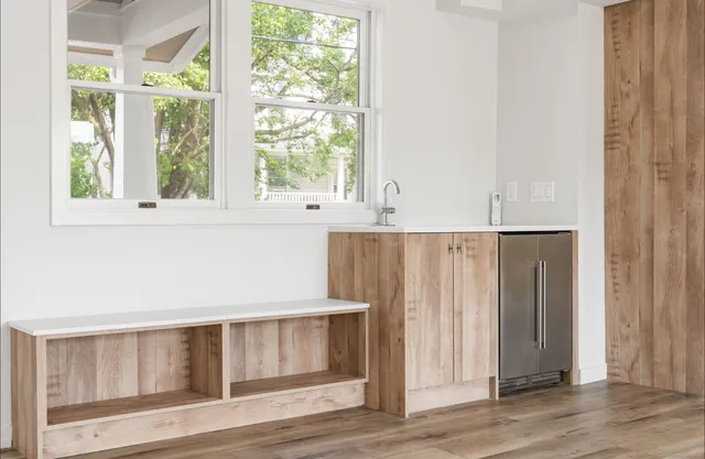a view of cabinets and wooden floor
