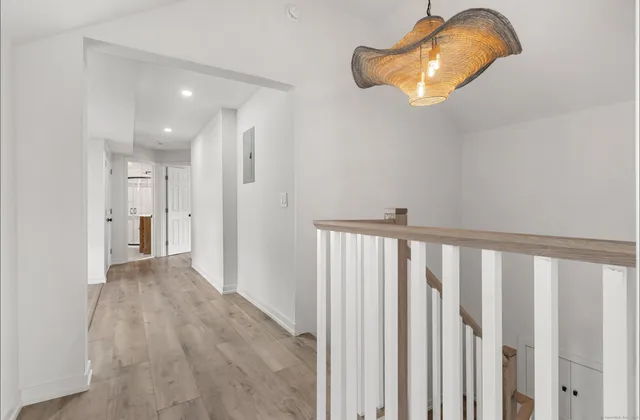 a view of a room with wooden floor