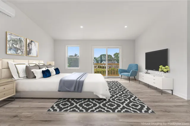 a bedroom with a large bed rug and a large window