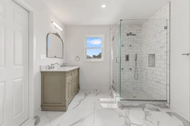 a bathroom with a shower and a sink