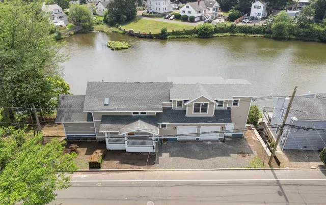 an aerial view of a house with lake view