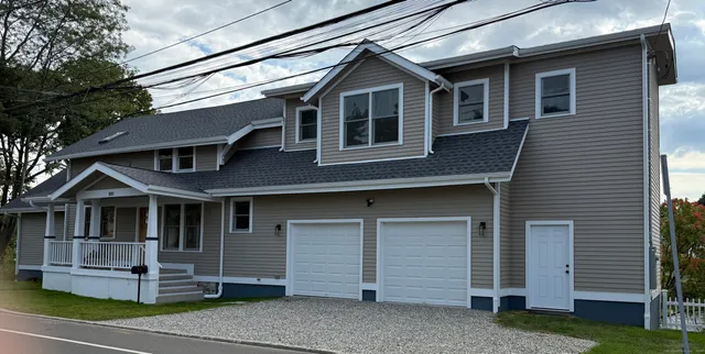 a front view of a house with a yard