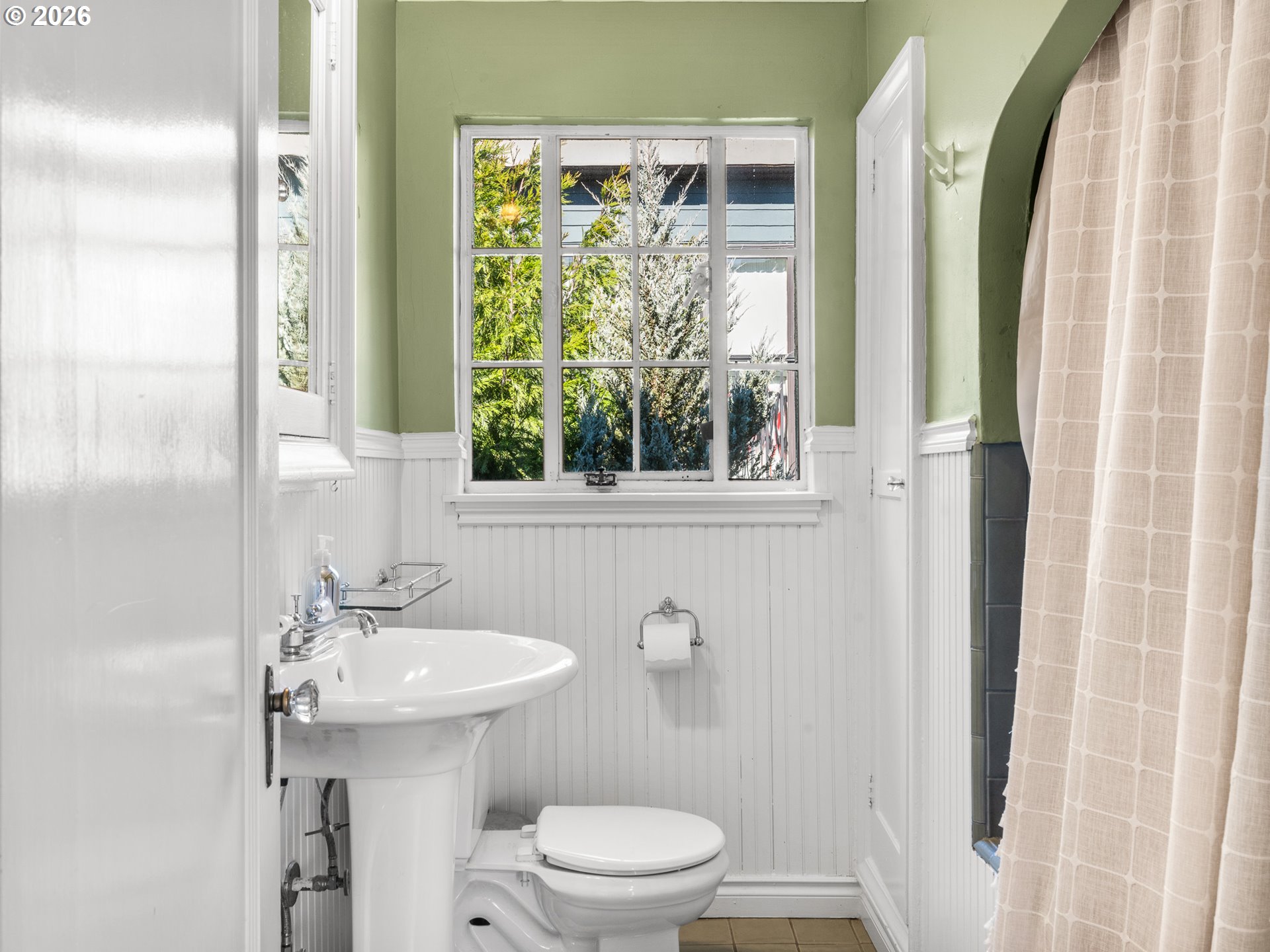 2325 Northeast Flanders Street, Unit 6 Portland, OR 97232 - Photo 14 of 20 a bathroom with a sink a toilet and a mirror
