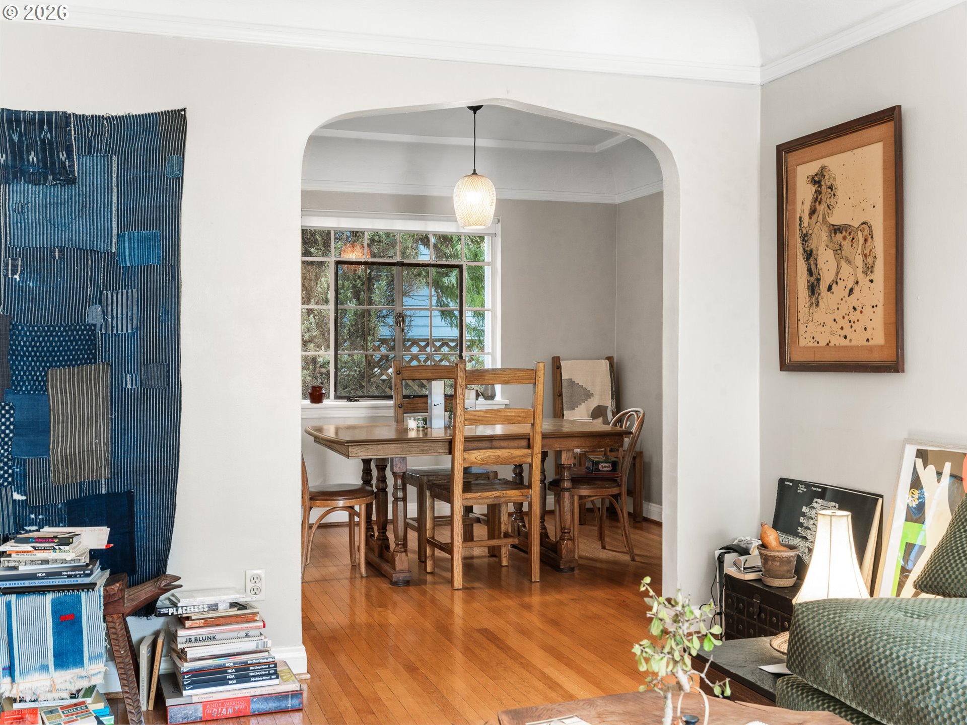 2325 Northeast Flanders Street, Unit 6 Portland, OR 97232 - Photo 7 of 20 a dining room with wooden floor and large windows