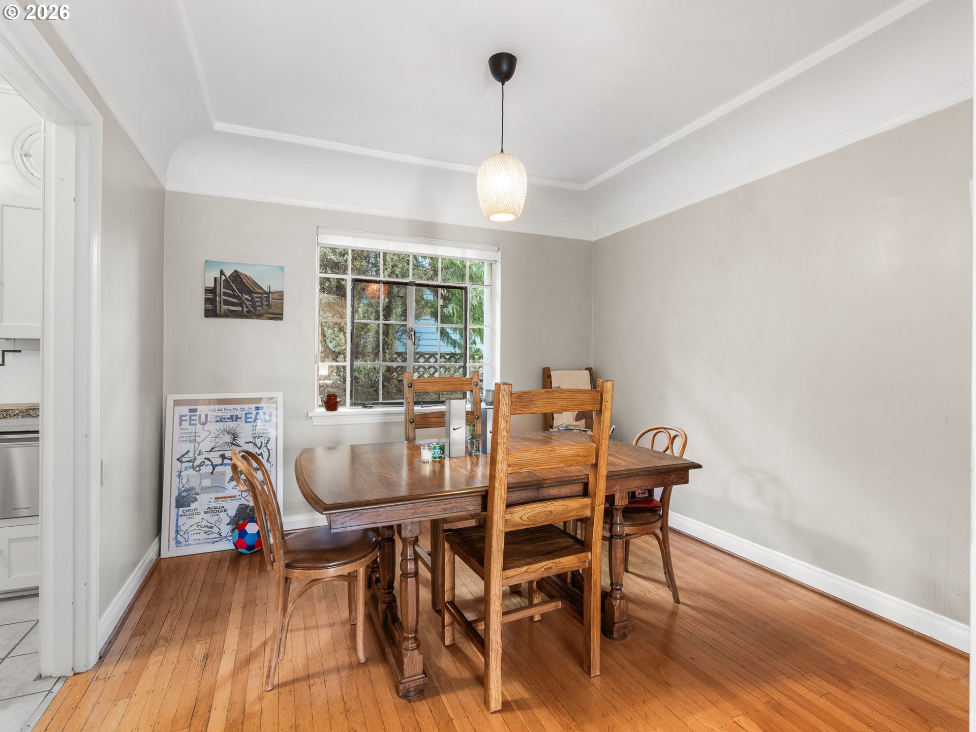 2325 Northeast Flanders Street, Unit 6 Portland, OR 97232 - Photo 8 of 20 a dining room with furniture a chandelier and wooden floor