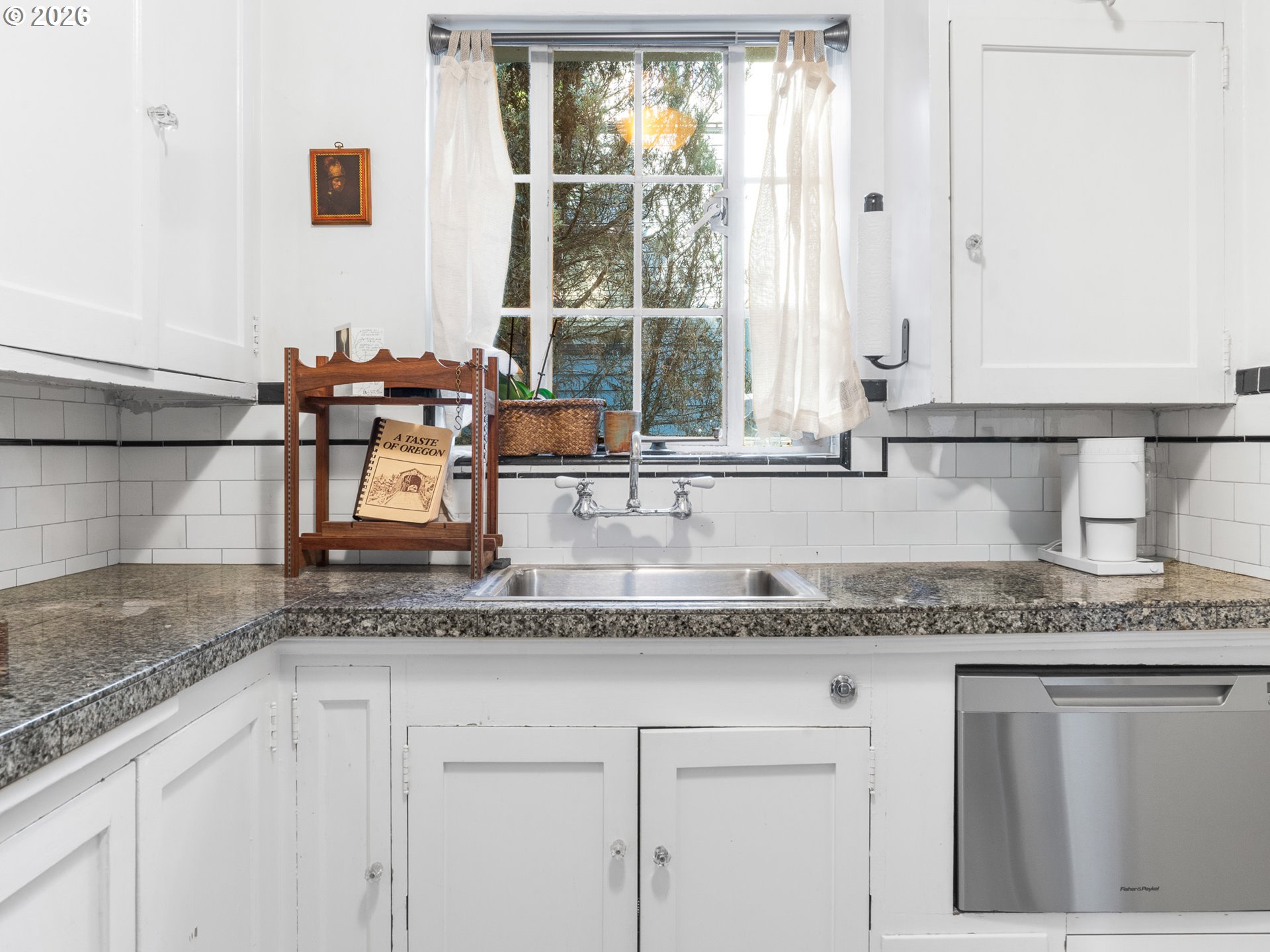 2325 Northeast Flanders Street, Unit 6 Portland, OR 97232 - Photo 10 of 20 a kitchen with granite countertop a sink and a window
