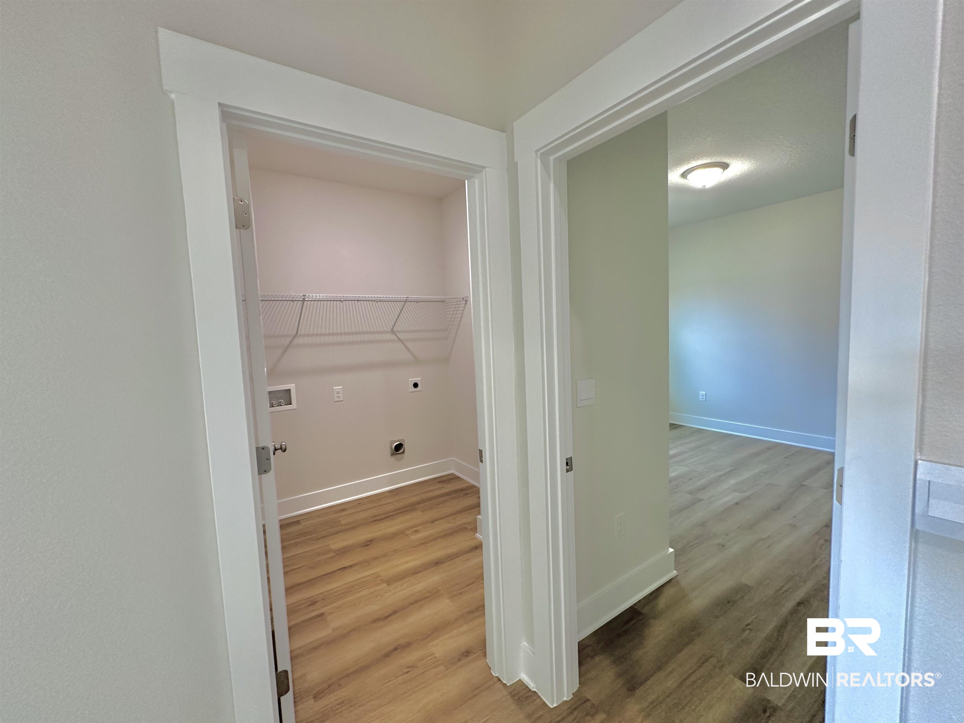 342 Barndling Street Fairhope, AL 36532 - Photo 22 of 50 Washroom with hardwood / wood-style floors, electric dryer hookup, and washer hookup