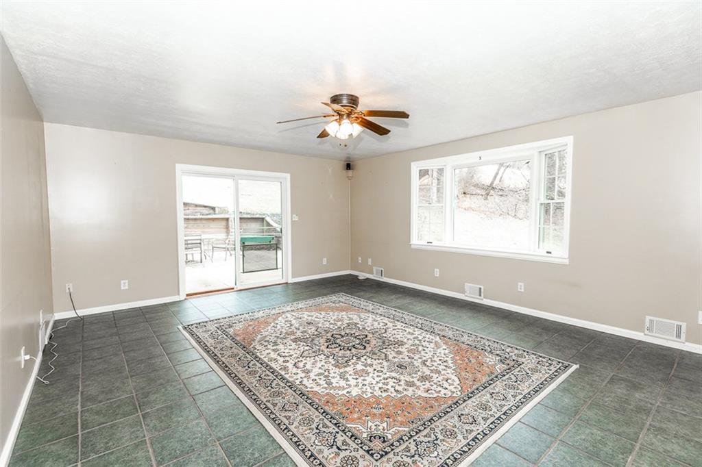 119 Union Church Road Mars, PA 16046 - Photo 5 of 25 Family room addition with sliders to patio and Koi pond
