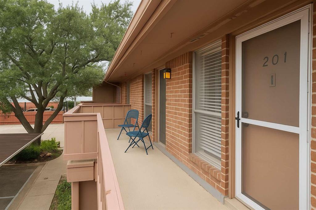 10526 Stone Canyon Road, Unit 201 Dallas, TX 75230 - Photo 20 of 21 a view of two chairs in a balcony
