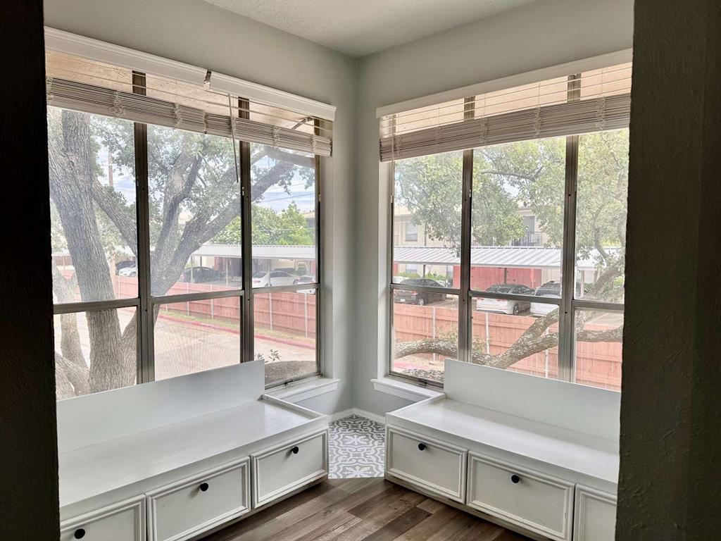 10526 Stone Canyon Road, Unit 201 Dallas, TX 75230 - Photo 10 of 21 a room with a large window and bed