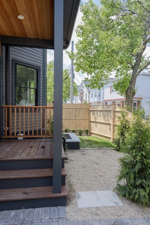 2 Adrian Street, Unit FRONT Somerville, MA 02143 - Photo 13 of 17 a view of a back yard of the house
