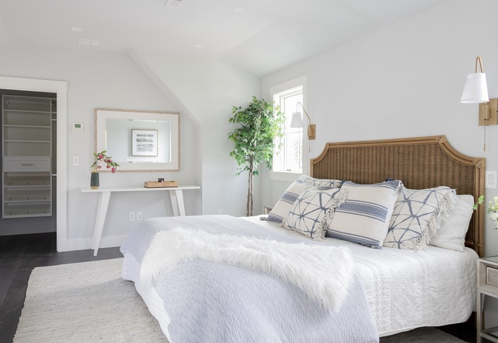 2 Adrian Street, Unit FRONT Somerville, MA 02143 - Photo 6 of 17 a bedroom with a large bed and a couch