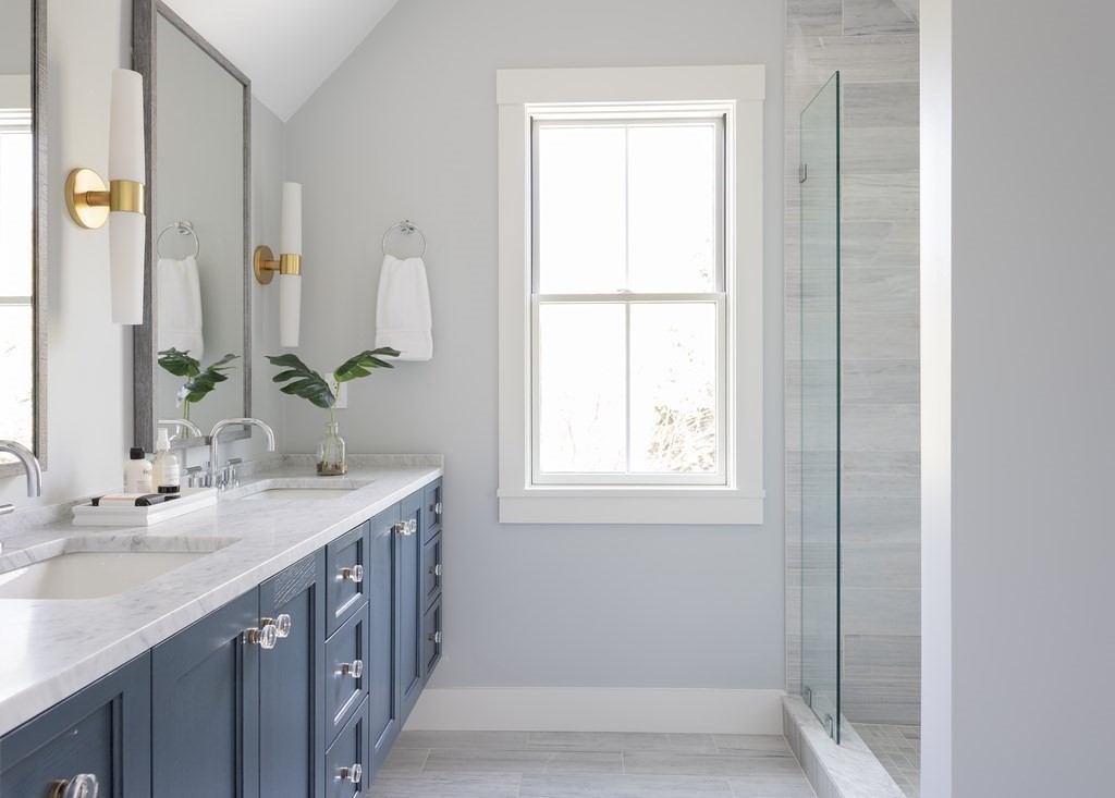 2 Adrian Street, Unit FRONT Somerville, MA 02143 - Photo 9 of 17 a bathroom with a double vanity sink and a mirror