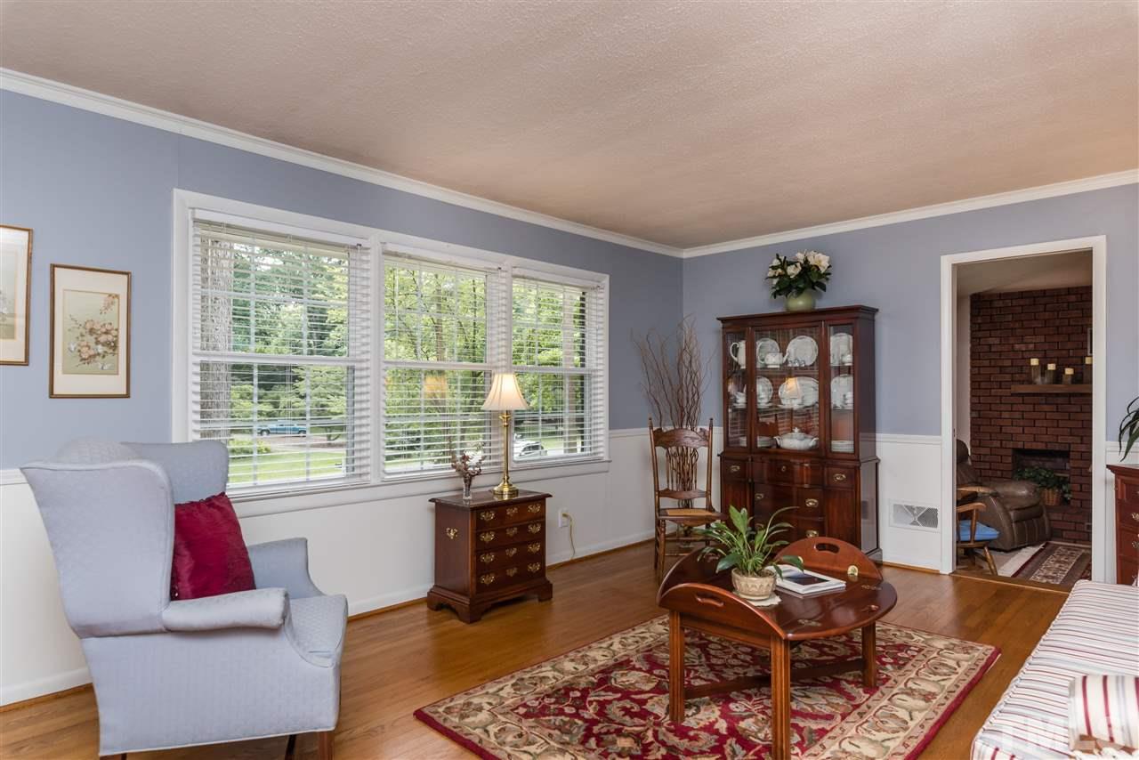 6405 Johnsdale Road Raleigh, NC 27615 - Photo 2 of 25 a living room with furniture and a floor to ceiling window