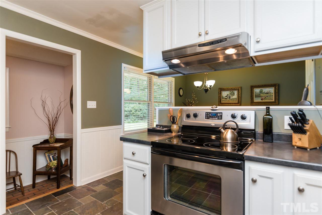 6405 Johnsdale Road Raleigh, NC 27615 - Photo 13 of 25 a kitchen with a stove and a sink