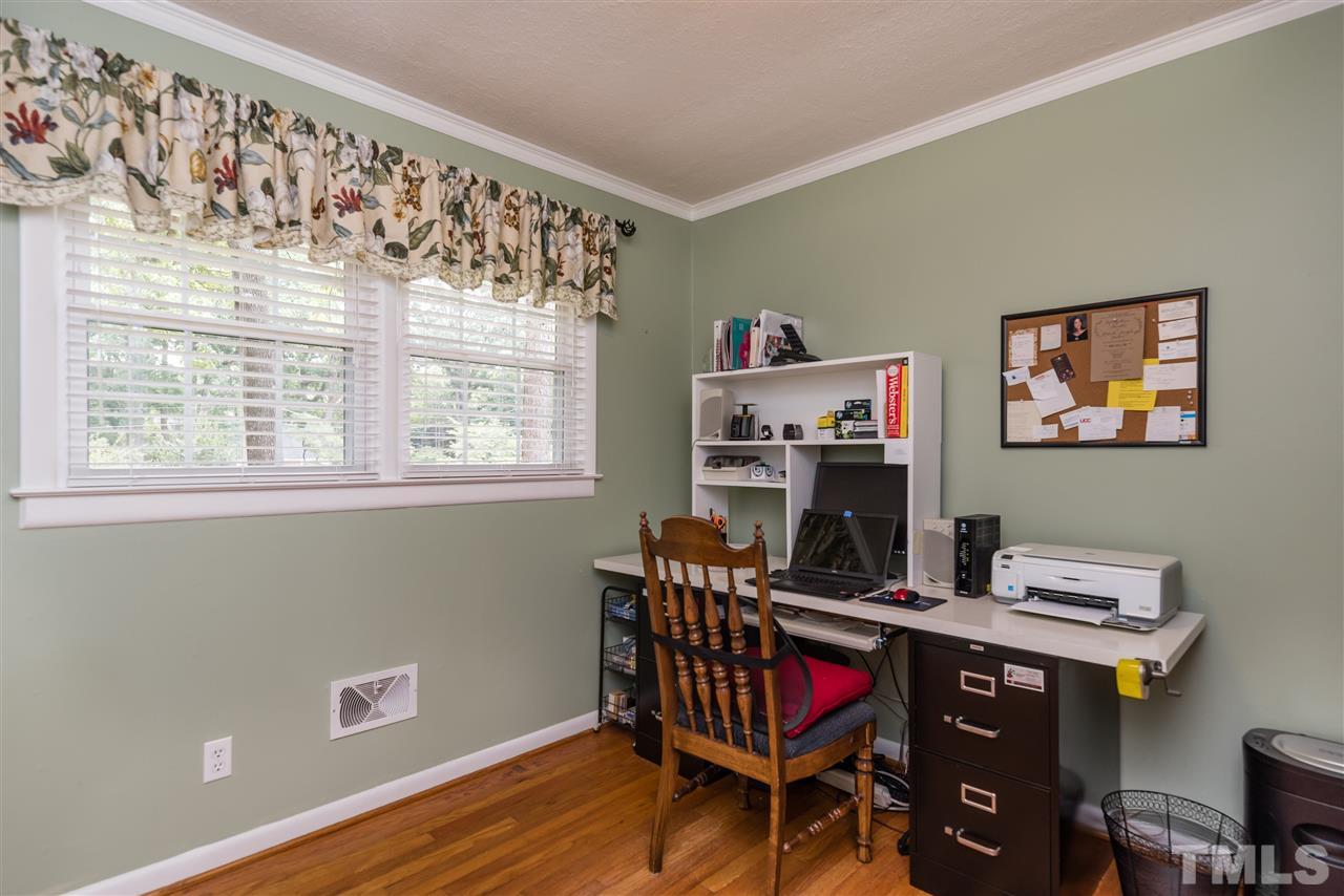 6405 Johnsdale Road Raleigh, NC 27615 - Photo 14 of 25 a workspace with furniture window and wooden floor